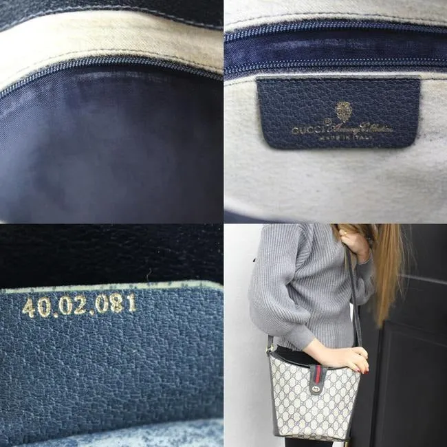 RARE, Gucci, navy blue Guccissima print leather, bucket bag w red & navy striped, top strap & gold GG logo accent