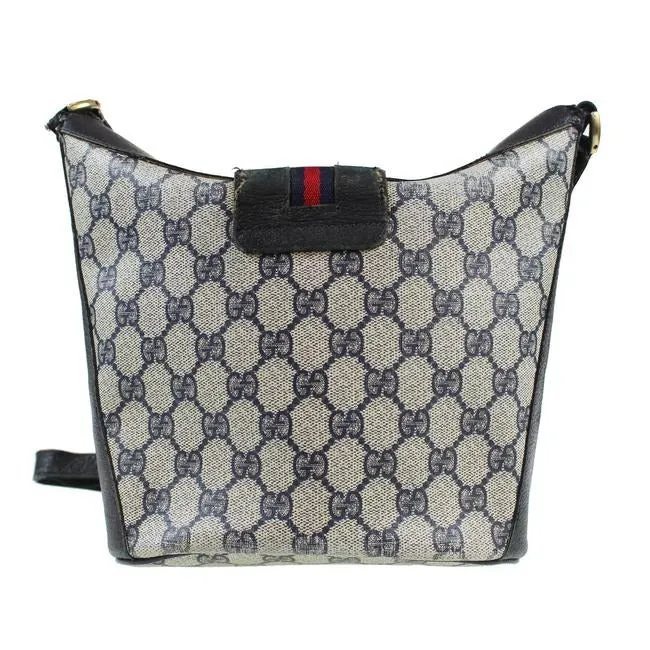RARE, Gucci, navy blue Guccissima print leather, bucket bag w red & navy striped, top strap & gold GG logo accent